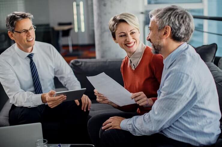 happy-couple-talking-while-having-consultations-with-their-agent-office_637285-11098