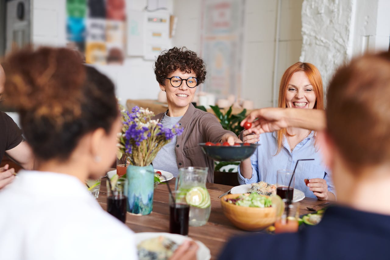 Group of people having a meal and enjoying themselves.